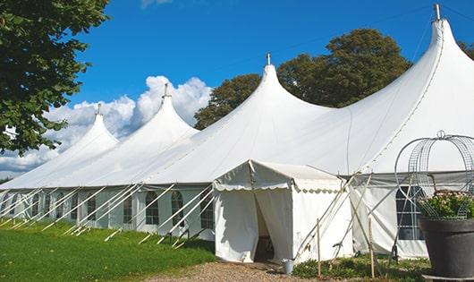 a line of sleek and modern portable restrooms ready for use at an upscale corporate event in Newport Coast